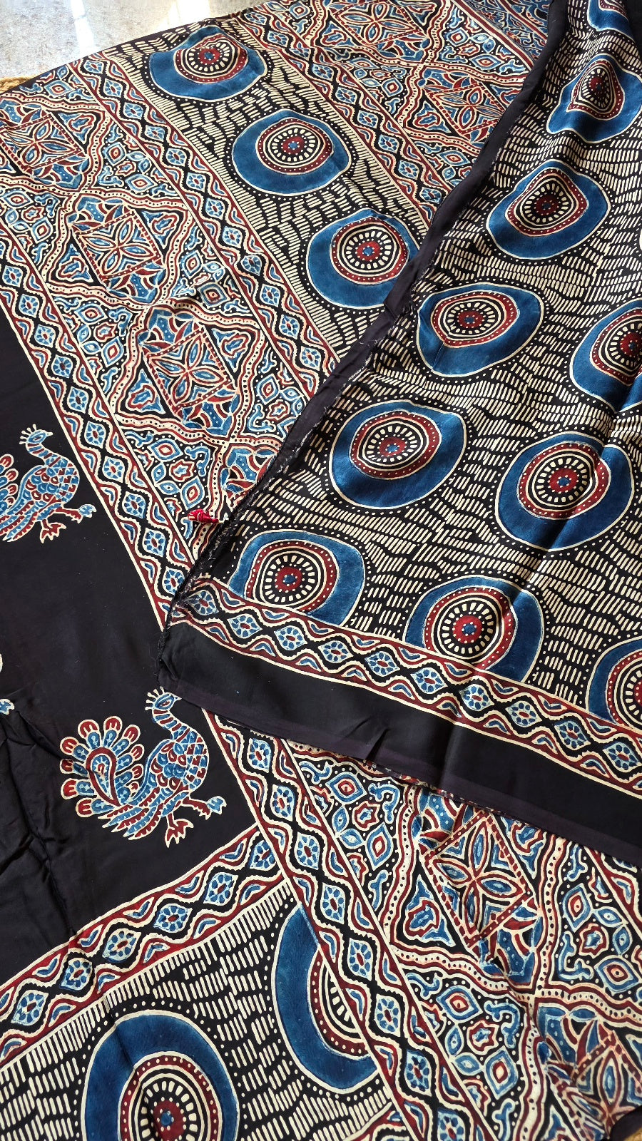 Black Ajrakh Modal Silk Saree with Peacock Buttas – Hand-Block Printed in Kutch
